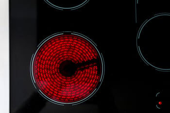 Electric cooking hob switched on glowing red